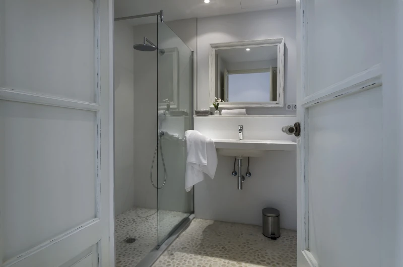 A studio bathroom with a walk-in shower