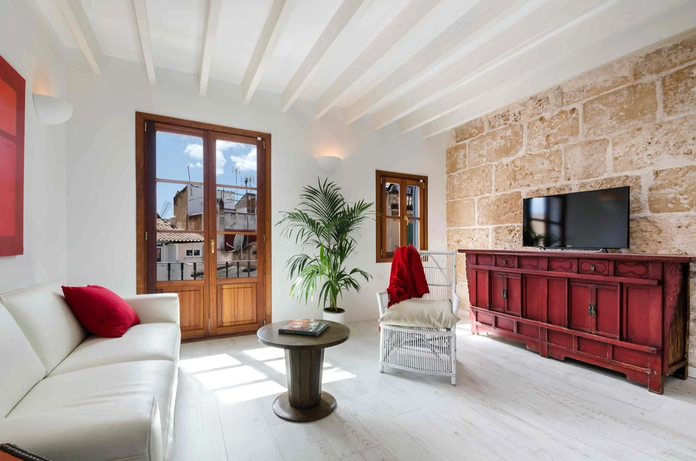 Sitting room with sofa and television